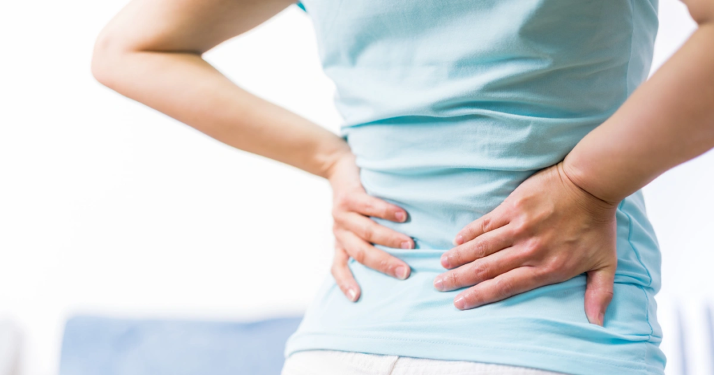 Woman suffering from lower back pain